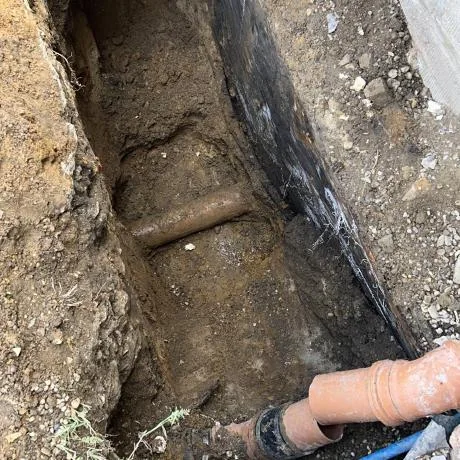 Blocked drain being cleared during drainage work in Essex
