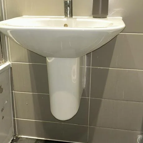 Plumbing and drainage work in Essex under a kitchen sink