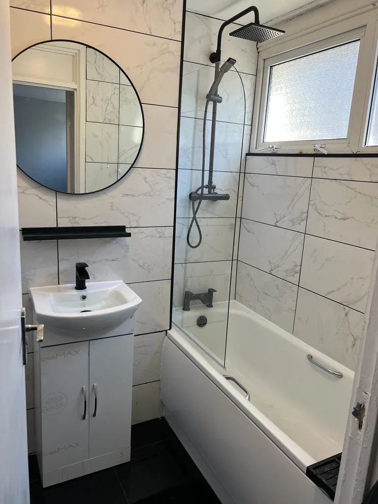 Completed bathroom installation at an Essex home with tiled walls