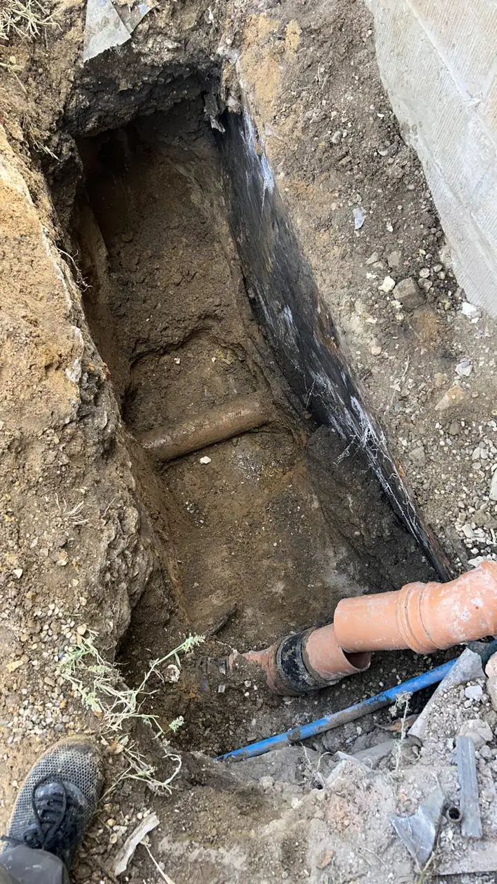 Plumbers in Corringham working on a domestic drainage repair